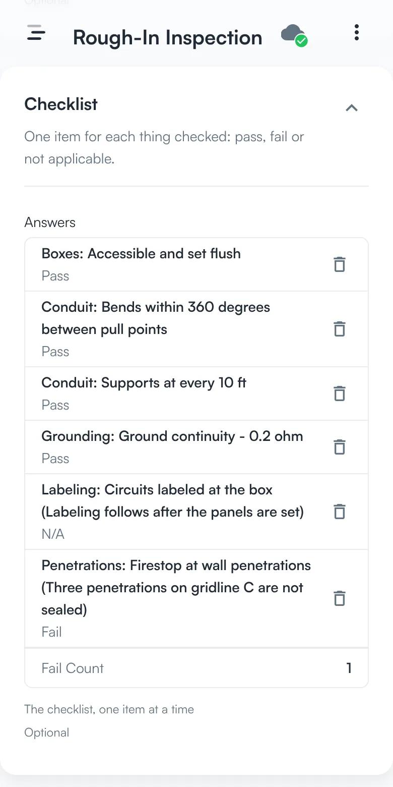 An inspection checklist with six items, each marked pass, fail, or N/A, one with a comment explaining the failure.